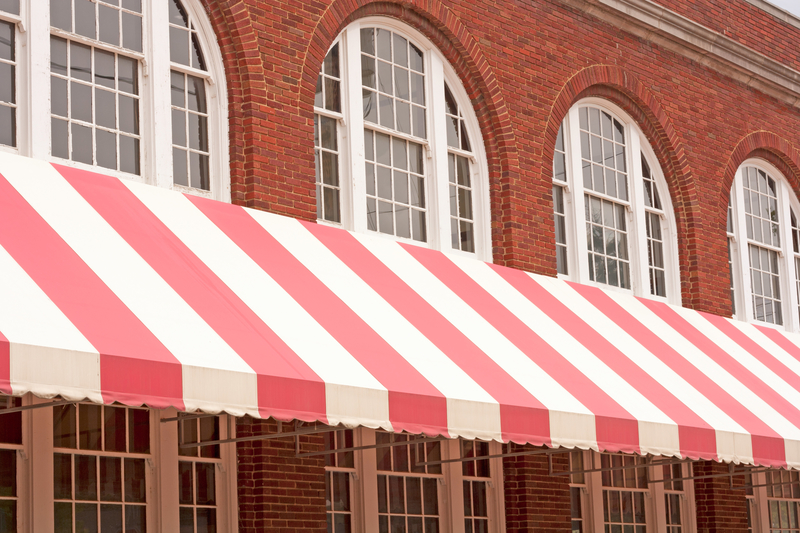 striped awning over white windows