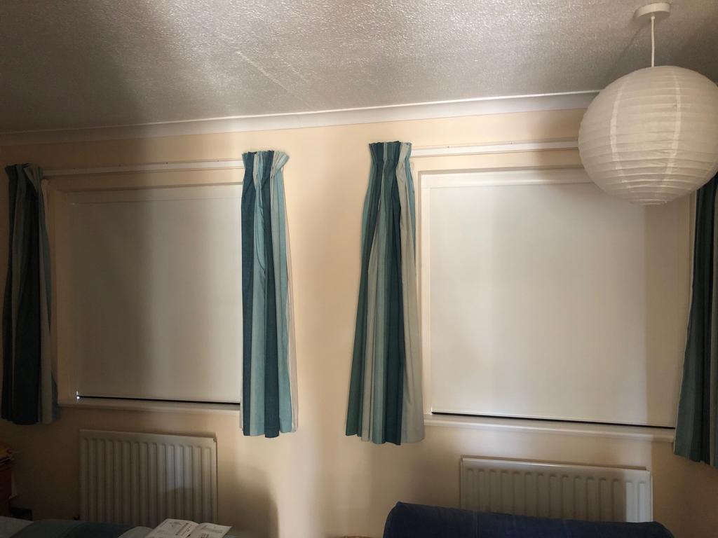 Room darkening blinds installed in room